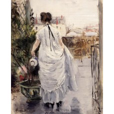 Young Woman Watering a Shrub