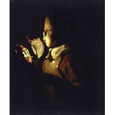 Boy blowing at a Lamp