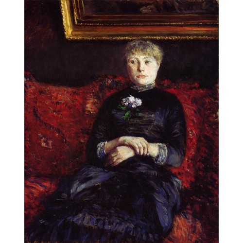 Woman Sitting on a Red Flowered Sofa