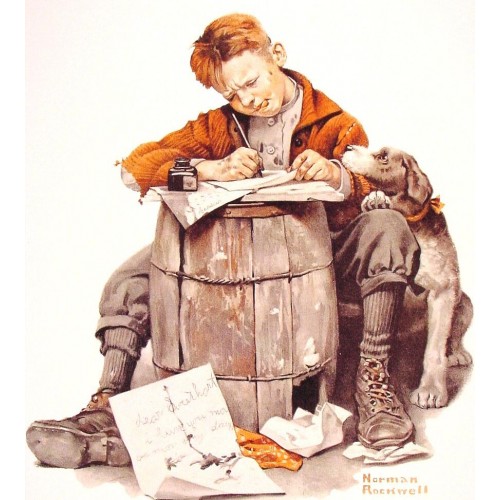 Little boy writing a letter